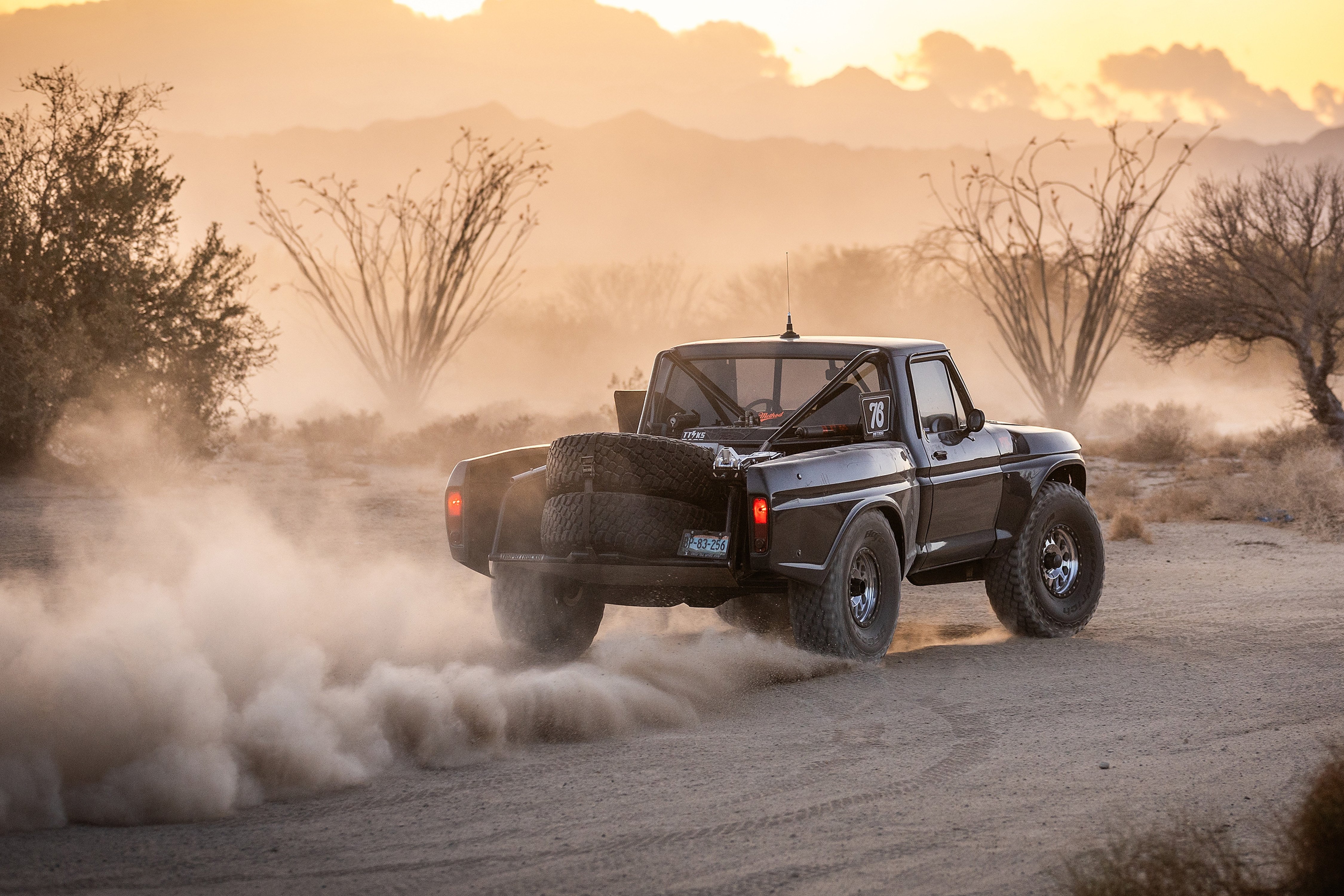 Side of a1978 Ford F250 at dusk on Method Race Wheels 305 Standard wheel.