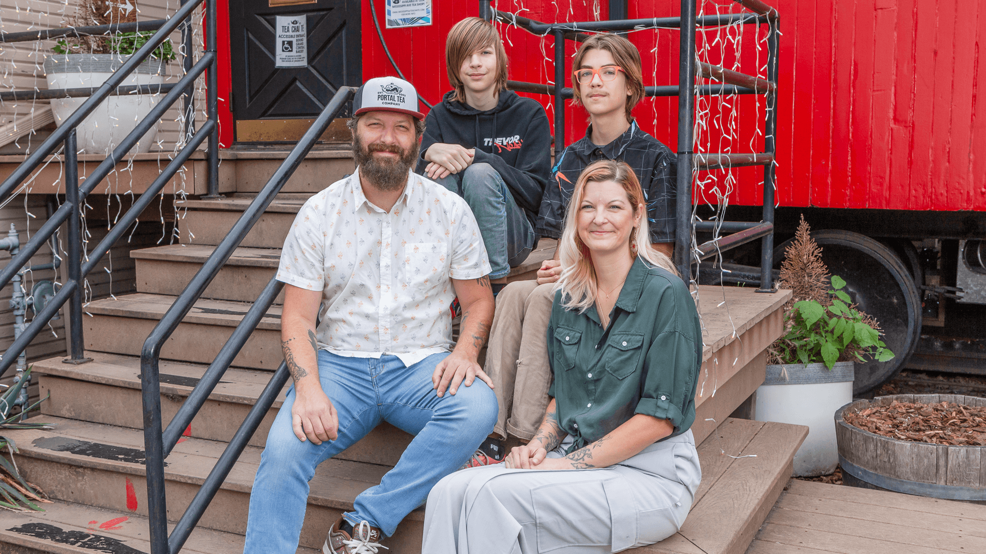 Portal Tea owners Dominic and Angela Valdes with their sons at their Sellwood tea caboose