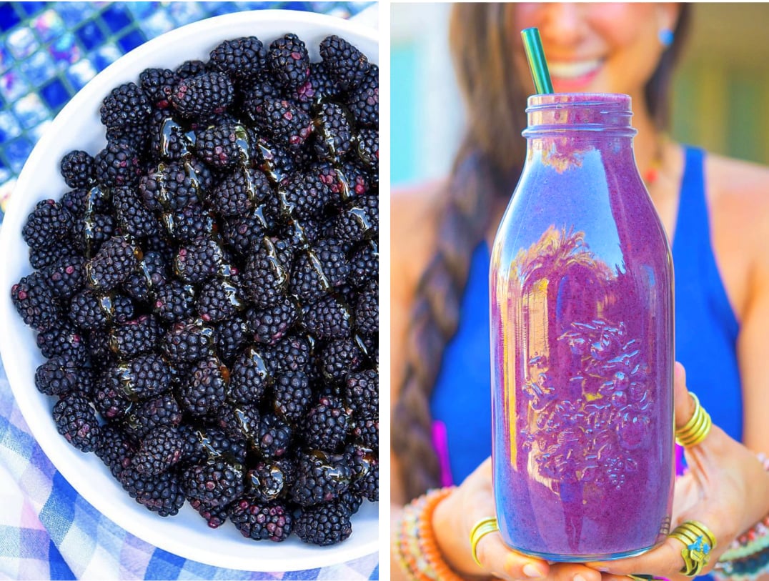 A bowl of blackberries and a jar of purple juice with kristina in the background