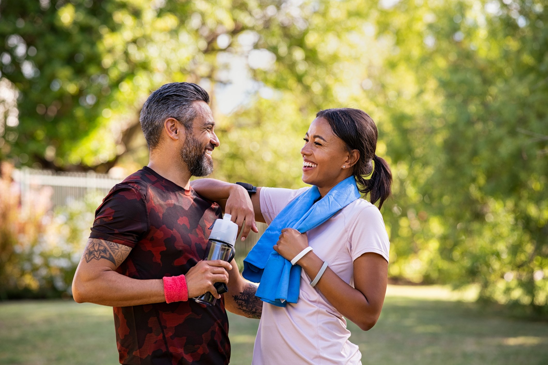 Man and woman exercising in the park to boost their fertility
