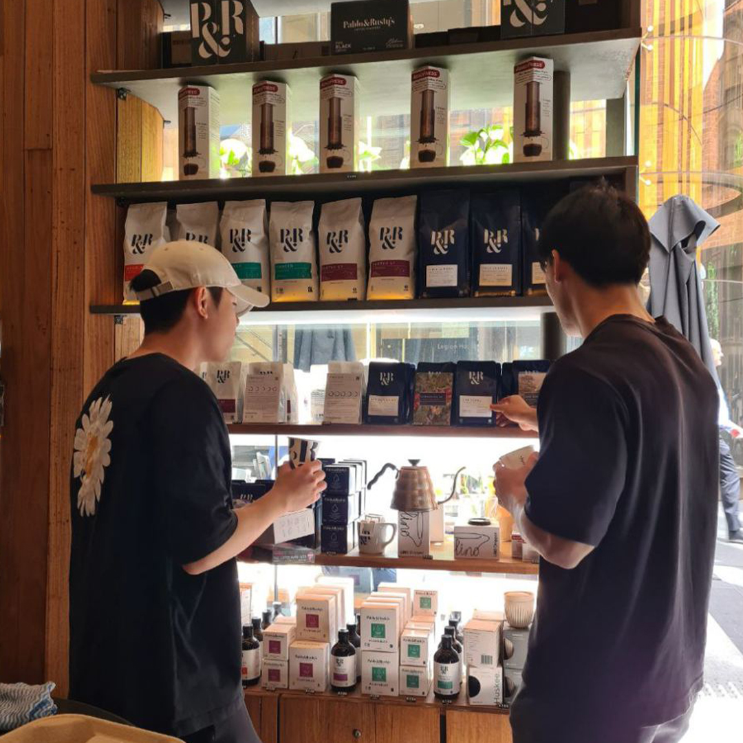 customers checking the retail shelf with P&R specialty coffee on display