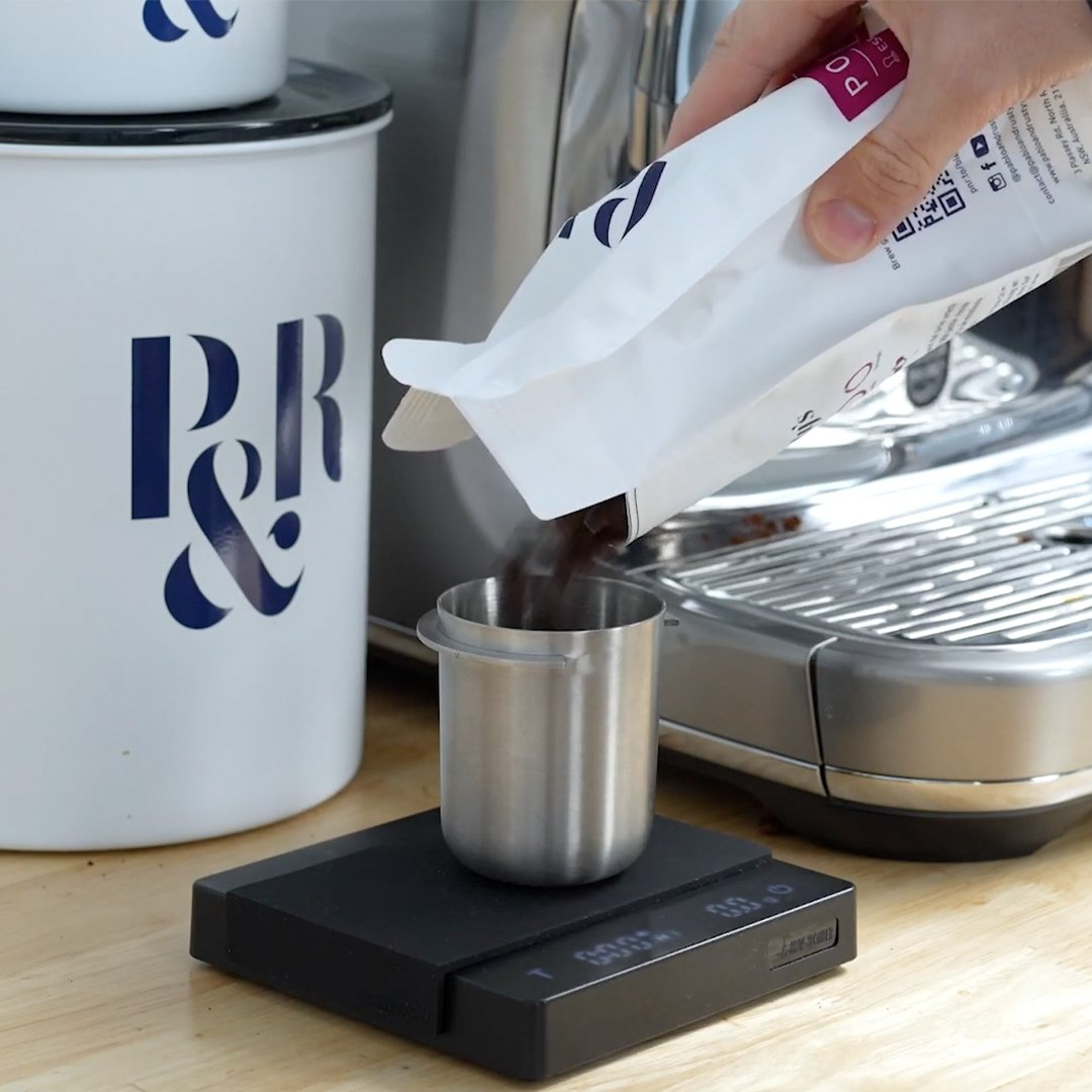 weighing coffee beans on a Timemore Mini Scale