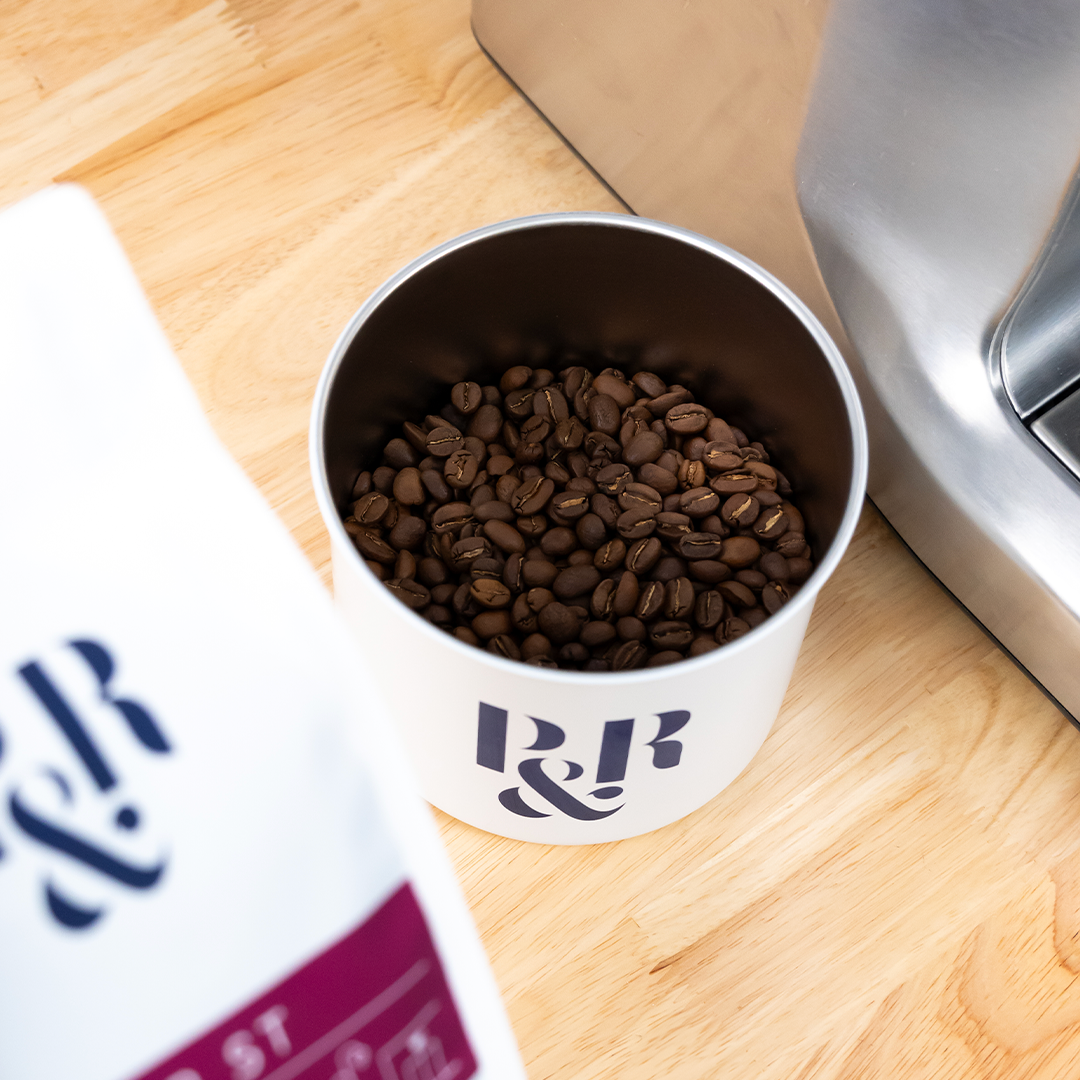 freshly roasted coffee beans inside a P&R Airscape coffee canister