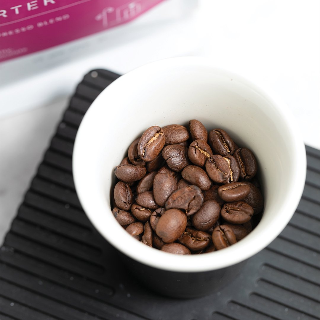 weighing coffee beans on a scale