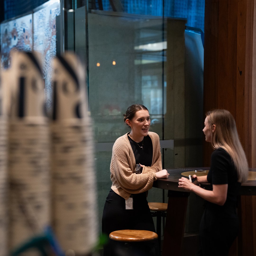 People conversing over coffee