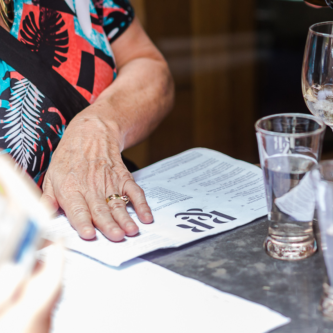 customer checking cafe menu