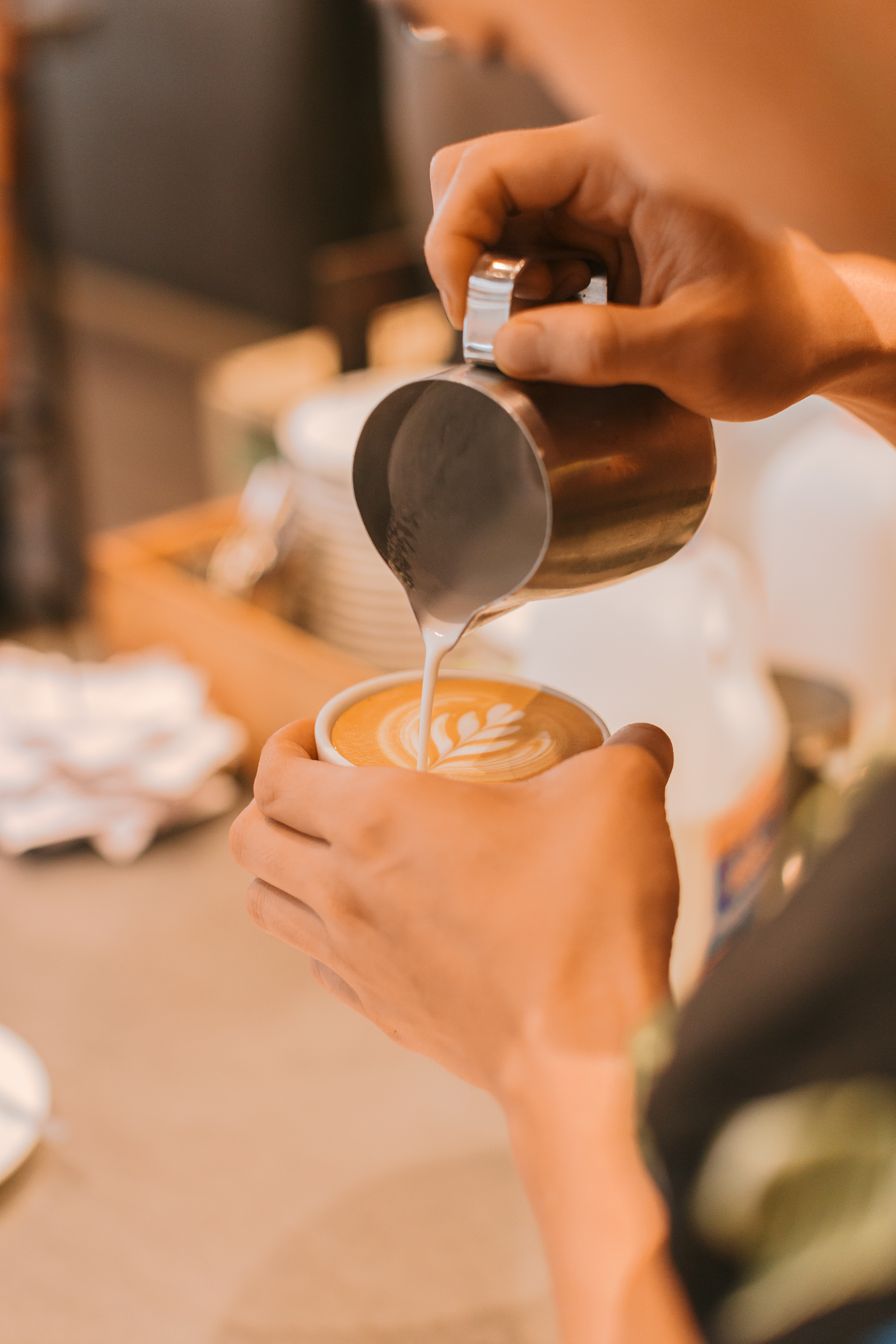 Barista pouring latte art