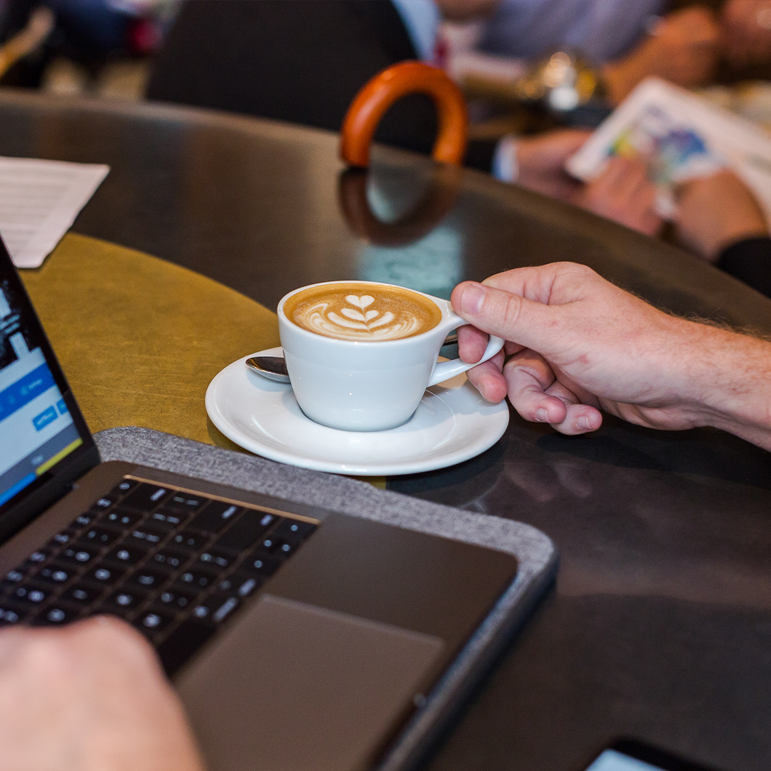 Customer enjoying a cup of freshly brewed P&R coffee 