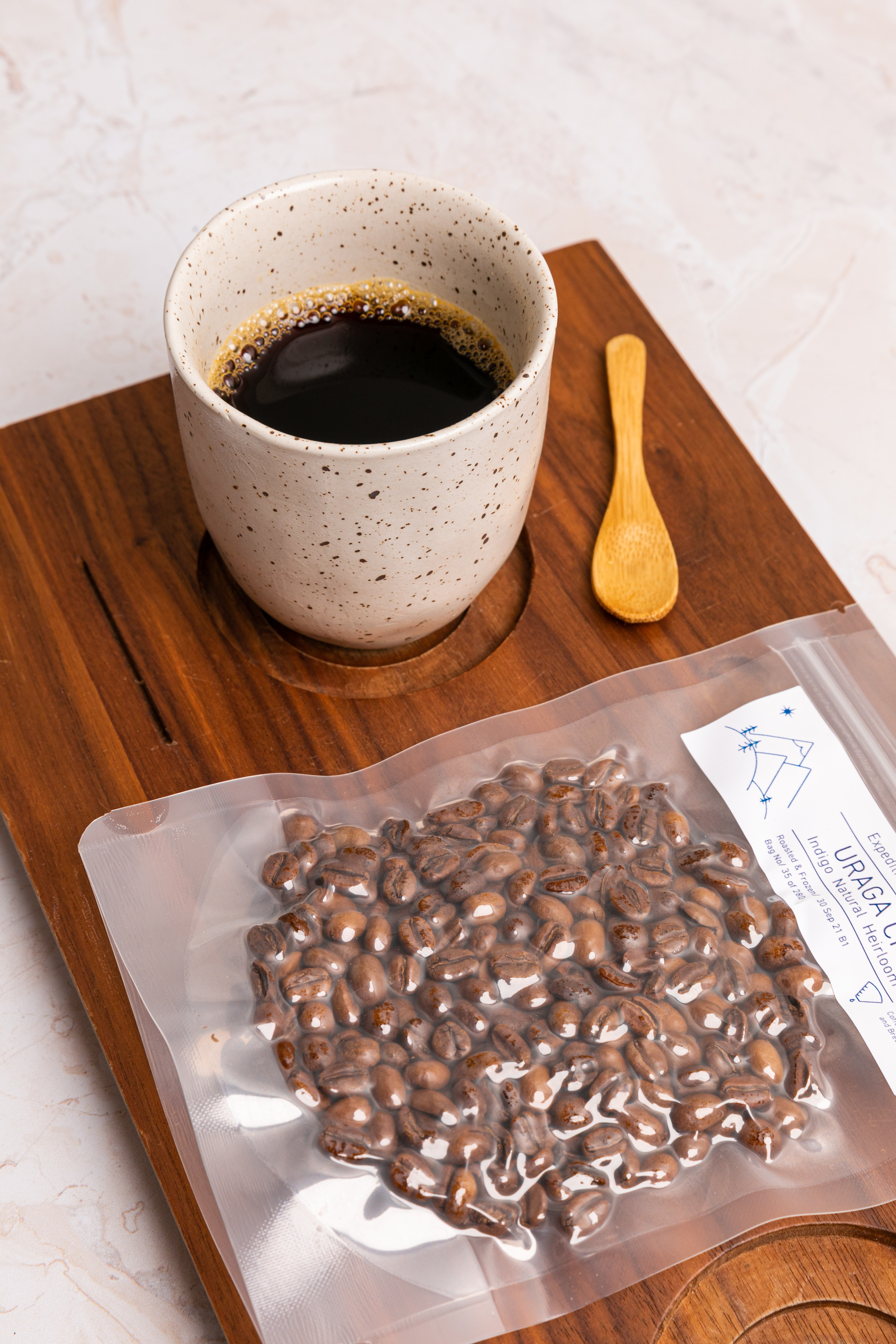 Expedition coffee brewed into a ceramic mug and presented on a wooden tray