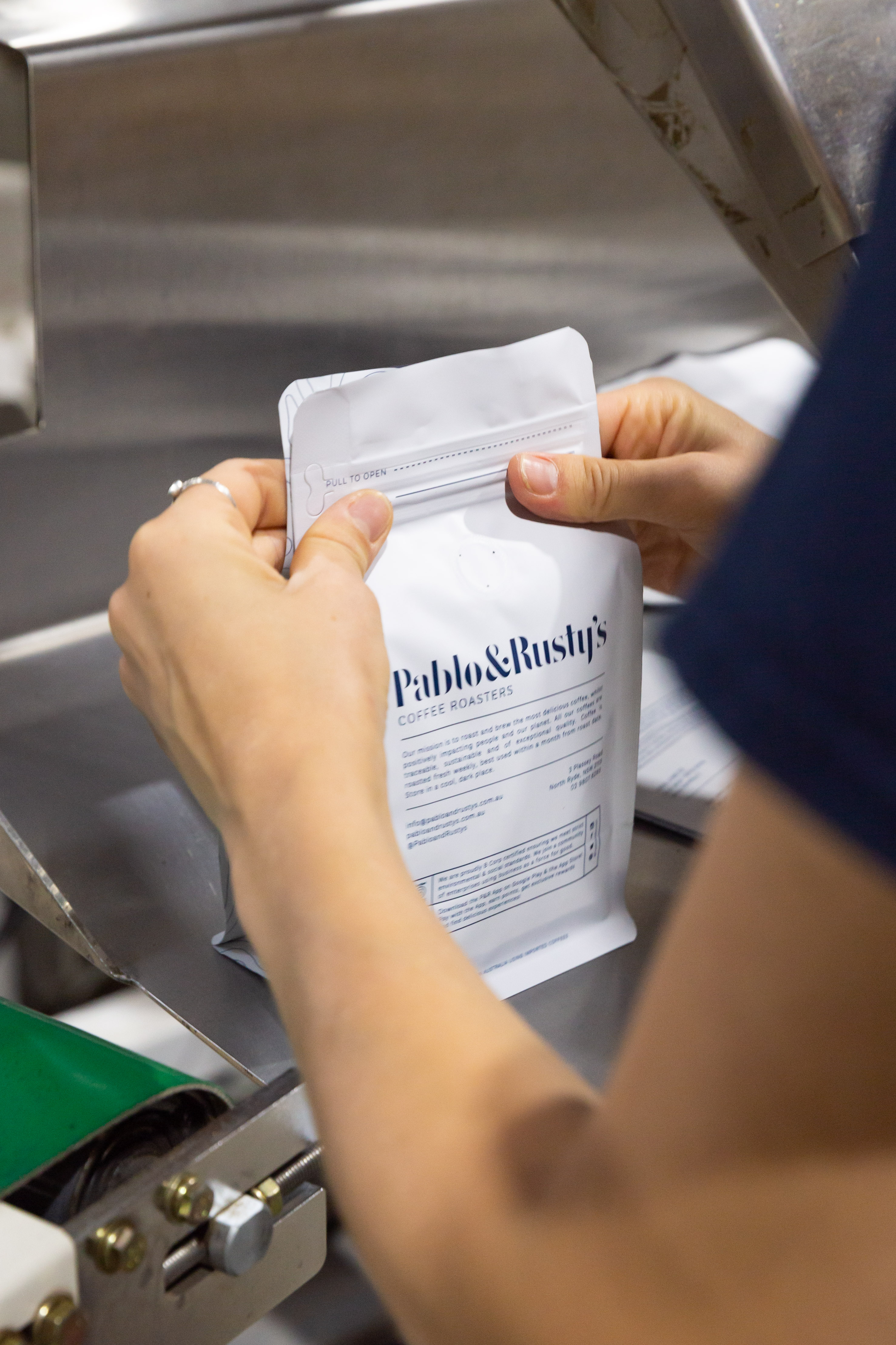 P&R Coffee bag being sealed on a bagging machine
