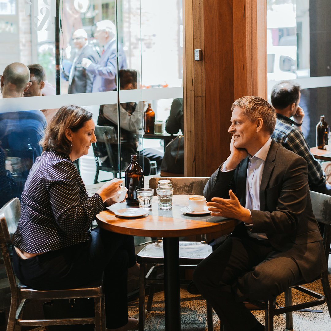 man and woman in a cafe