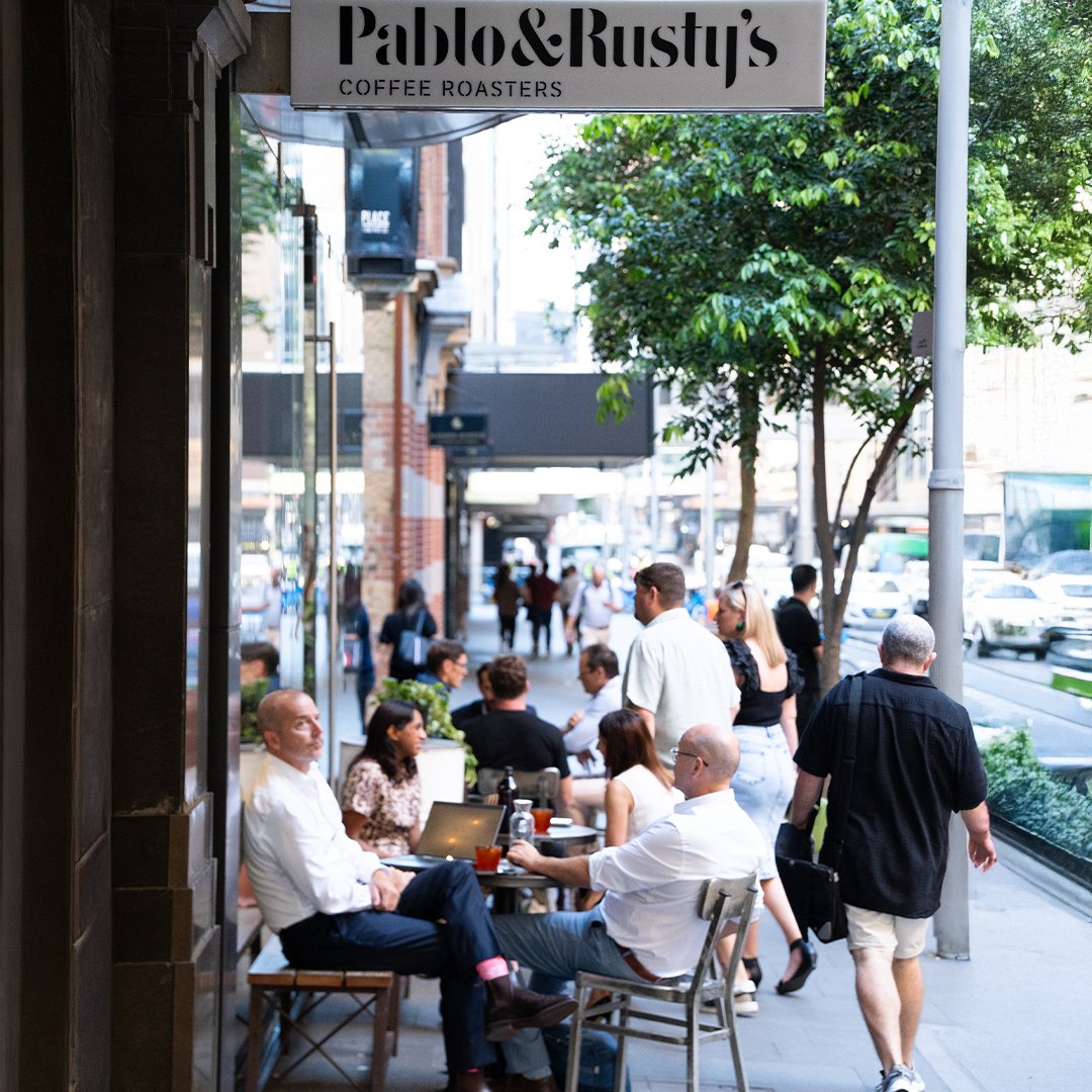 people outside a cafe
