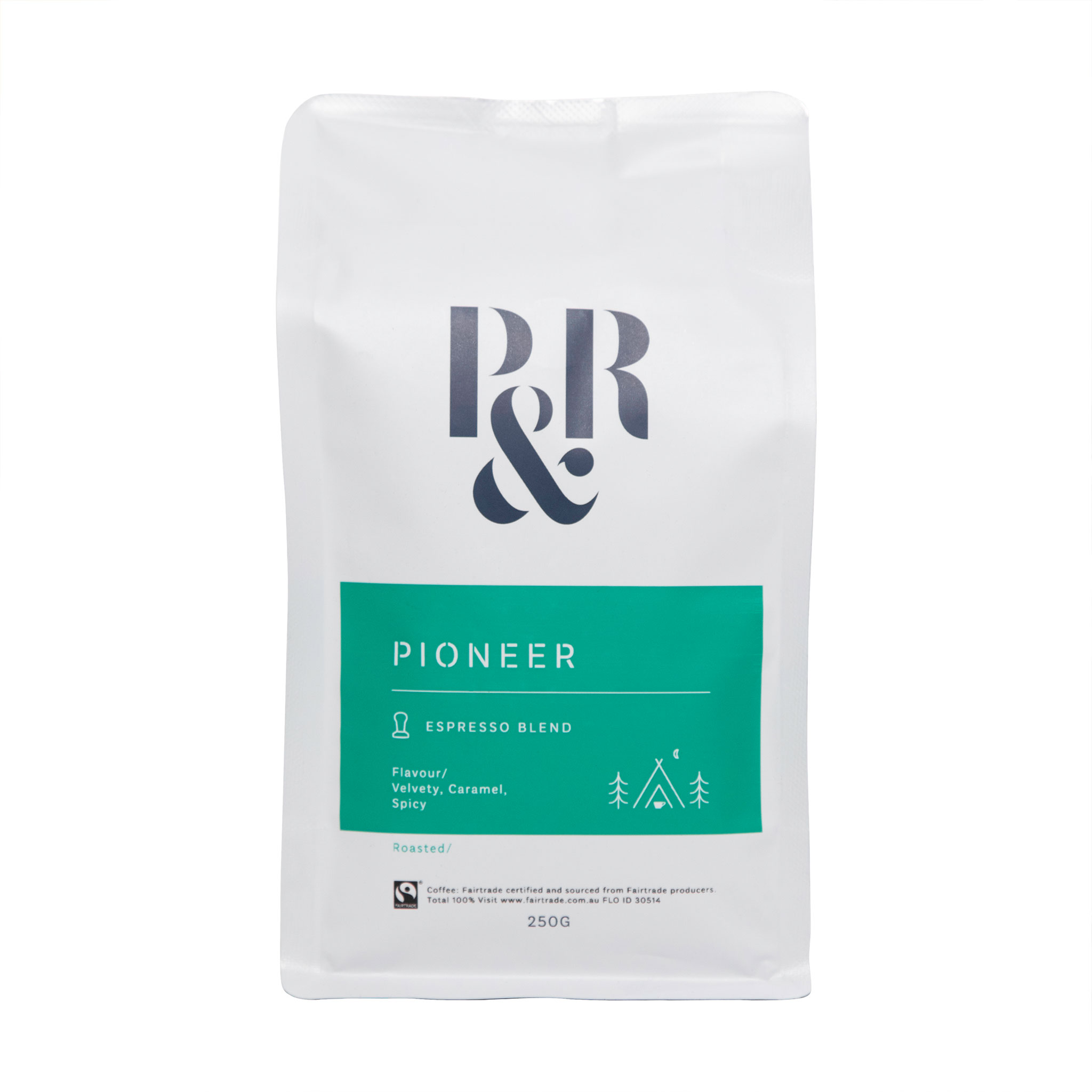 A bag of Pablo & Rusty’s Pioneer Blend 250G coffee beans. The bag is white with a green text box listing flavour notes as Velvety, Caramel, and Spicy. Underneath is the Fairtrade logo and the text “Coffee: Fairtrade certified and sourced from Fairtrade producers. Total 100%