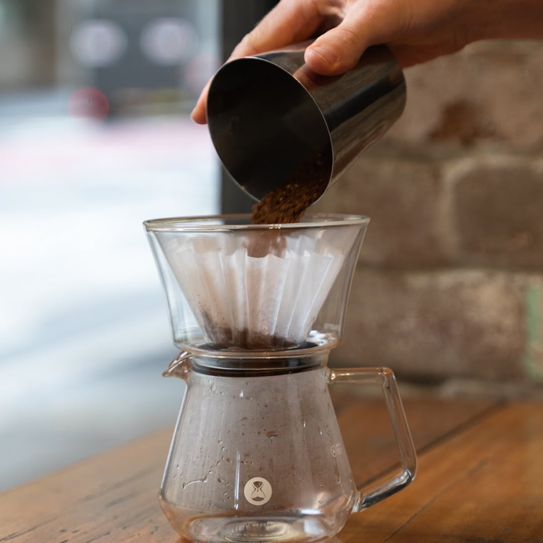 pouring coffee grounds