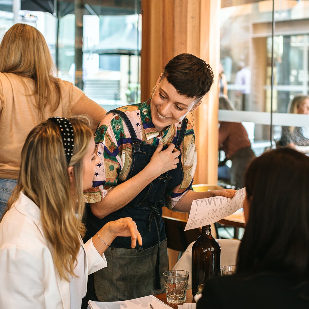 Cafe staff happily serving the customers