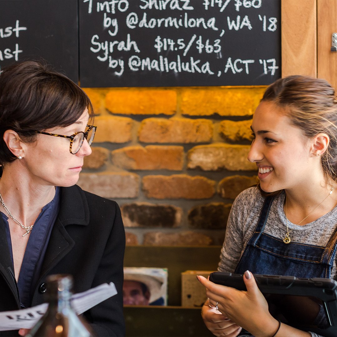 Cafe staff happily serving the customers