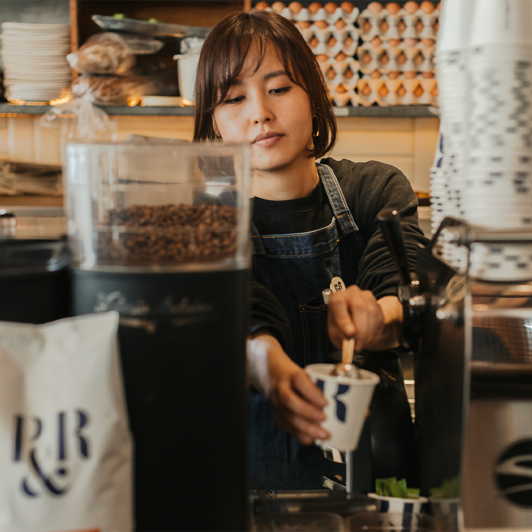 cafe staff brewing delicious coffee