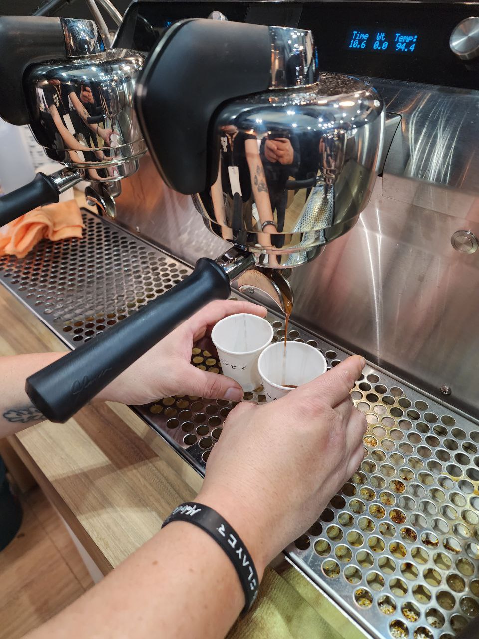 Two espresso shots being pulled from a slayer coffee machine
