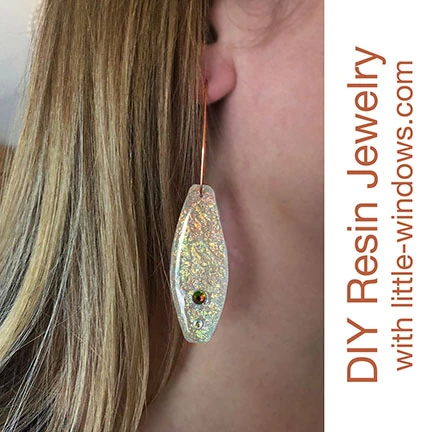 resin jewelry earrings doming long opal texture film on display