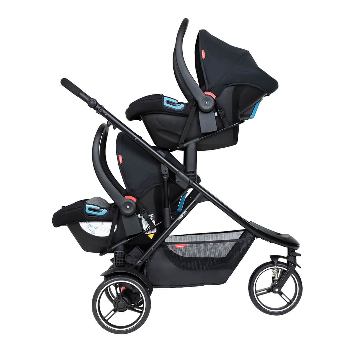 2 parent facing infant carseats attached to dot pram using travel system adaptors