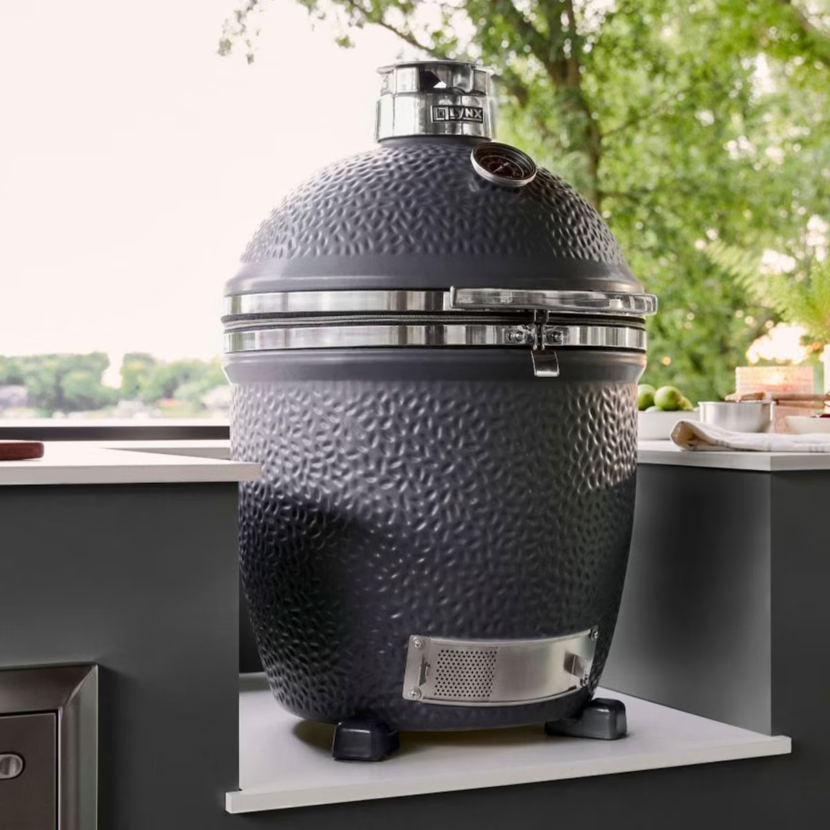 Lynx LCGRMG 18 Inch Built-In Ceramic Kamado Charcoal Grill - Matte Gray - Island Insert - Left Side View - Lifestyle
