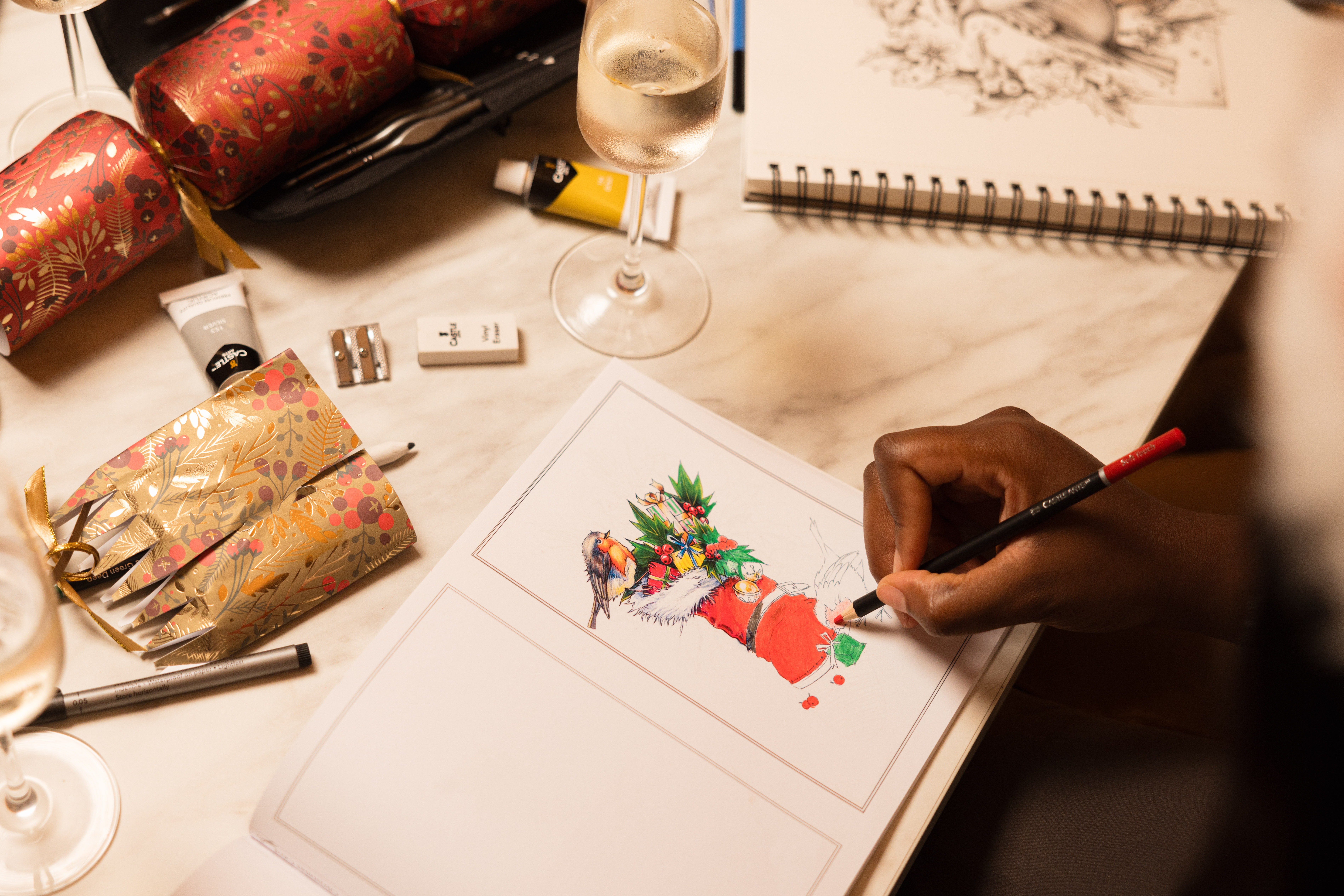 Artist uses Castle Arts coloured pencils to colour in a festive illustration.