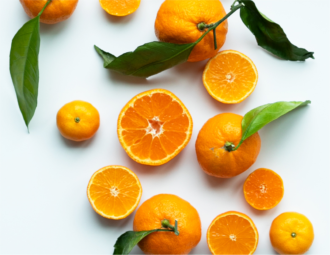 a variety of oranges on a whicte background