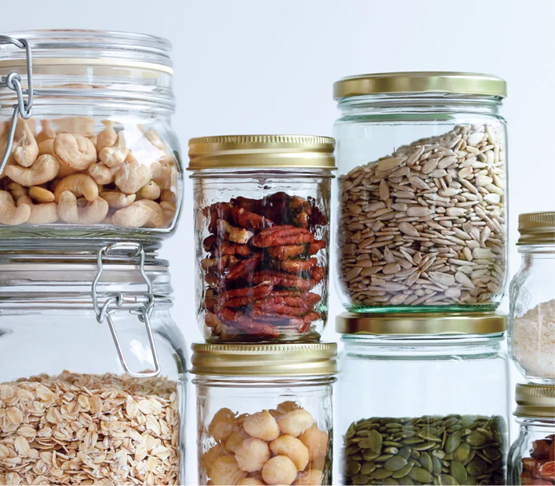 stacked glass jars filled with nuts and grains