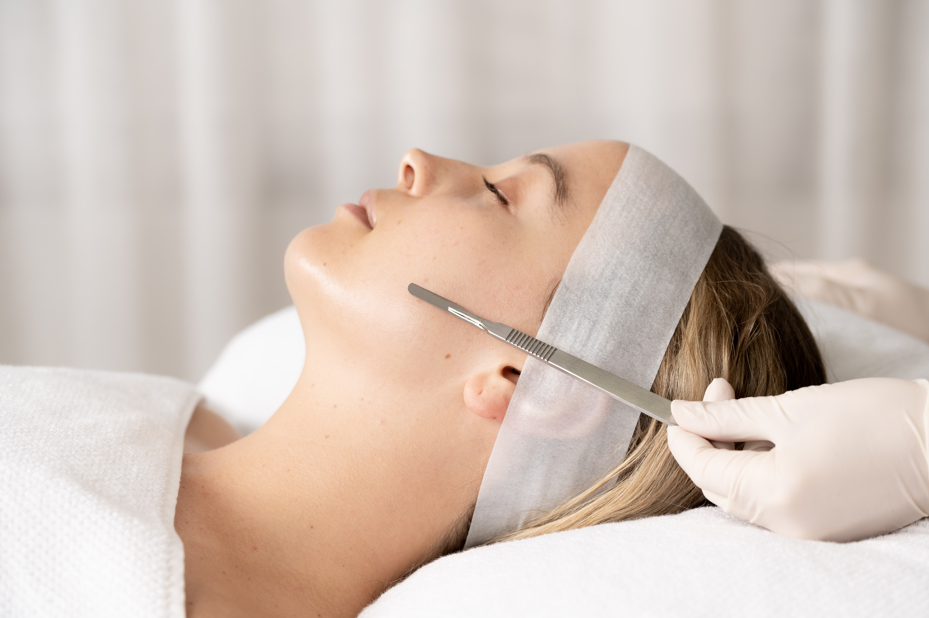 Dermaplaning skin treatment being performed on a woman's face at The Clinic Bondi
