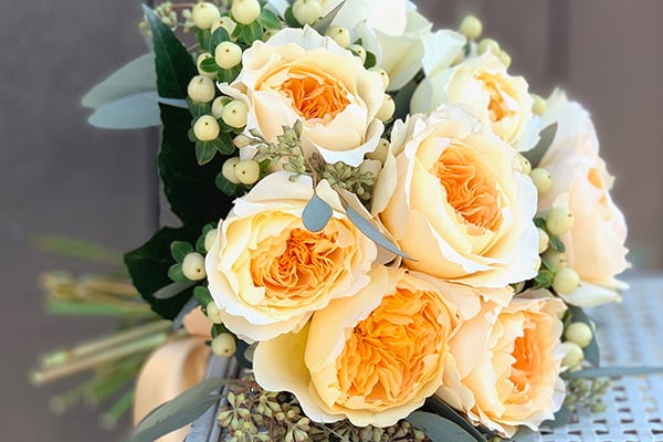 hand-tied bridal bouquet of peach colored roses