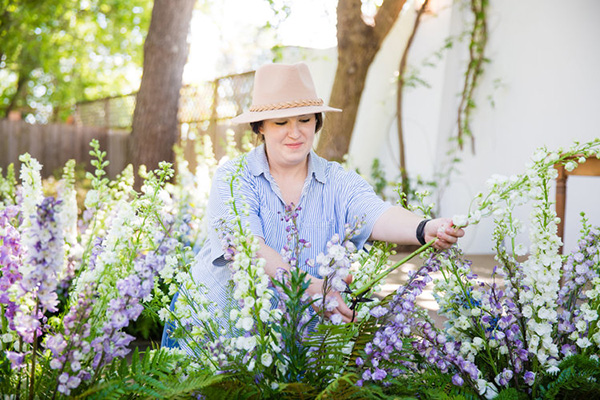 FDI graduate Meagan prunes snapdragons in her cutting garden.