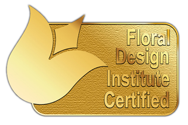 This gold lapel pin with a tulip on it is awarded to Floral Design Institute graduates who achieve FDI certification.