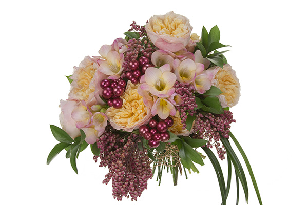 This stylish wedding bouquet in pink hues mixes garden roses, freesia, pieris, Israeli ruscus, and lily grass, then adds accented beads for a bit of sparkle.