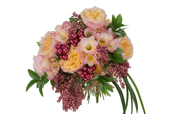 This stylish wedding bouquet in pink hues mixes garden roses, freesia, pieris, Israeli ruscus, and lily grass, then adds accented beads for a bit of sparkle.