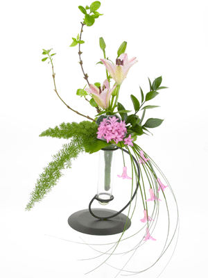 Insert two lily buds, shadowing each other, into the bouquet holder.