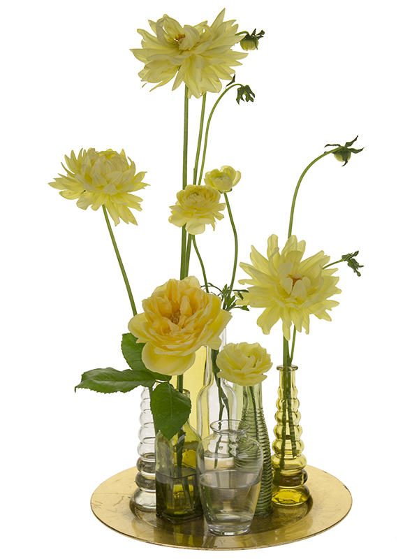 Place beautiful blooms from the garden in the vases. Vary the height of the flowers for best effect.