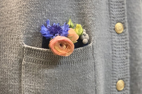 The floral corsage is ready to wear and can be tucked into a sweater or jacket pocket.