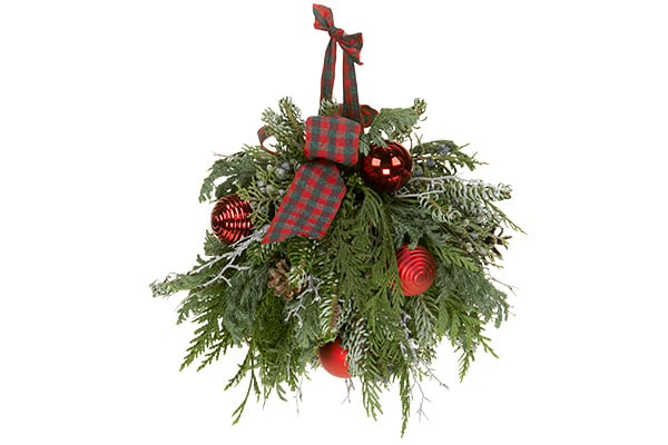 This Christmas Kissing Ball is filled with evergreens, pine cones, colorful ornaments, and festive ribbon for a beautiful effect.