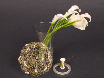 Materials for this design include some mini callas, gold bullion wire, a gold wire collar, and clear waterproof tape.