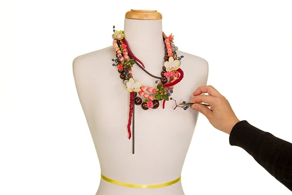 n addition of small florets, and berries using tweezers.