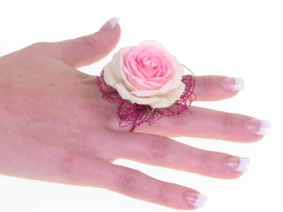 Add a single diamante pin to the center of the flower for sparkle.