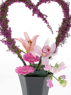 Insert flowers like lilies, orchids, and Gerbera daisies into the foam. 