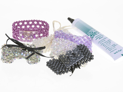 Materials for corsages include bracelets, cold glue, and some beautiful blooms.