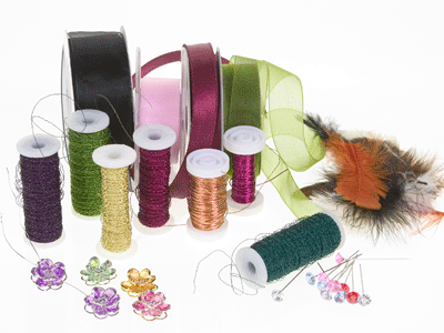 Gather wires, colorful ribbons, diamante pins, Lomey gems and feathers to decorate the corsages.