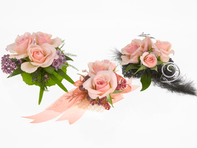 Add roses for a finishing touch to each corsage.