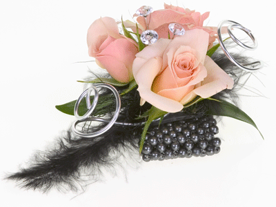 Create a contemporary corsage by mixing spray roses and Israeli ruscus with feathers, aluminum wire, and diamante pins for an artistic touch.
