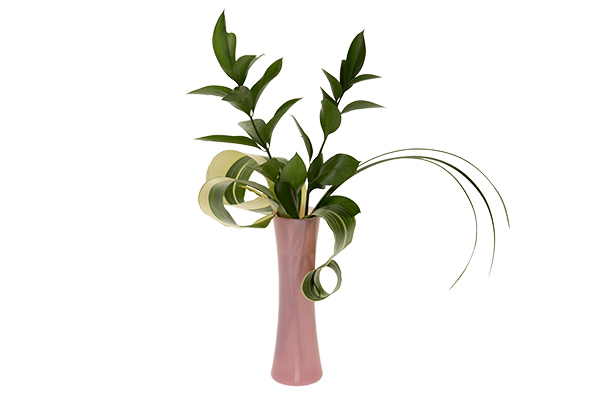 Add some rolled aspidistra leaves to the greenery in the vase.