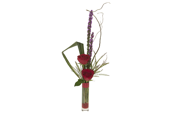 This Valentine's Day budvase features red roses, liatris, flax, grevillea, and curly willow.