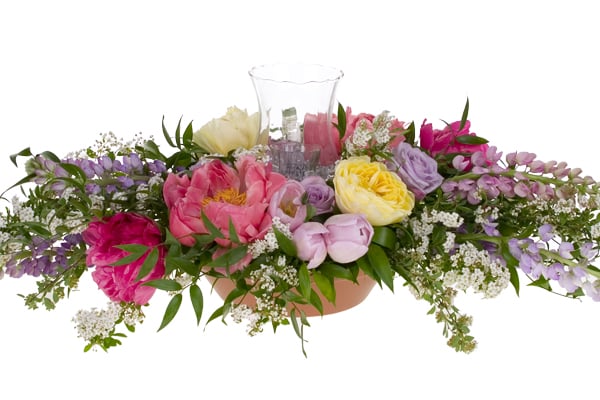 Fill in the arrangement with smaller blooms around the base.