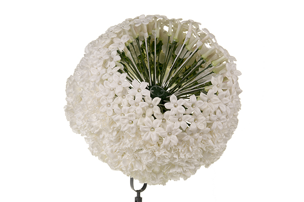 Begin placing the stephanotis blooms in circles.